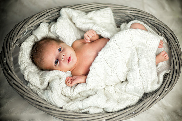 Newborn photography in a wicker basket